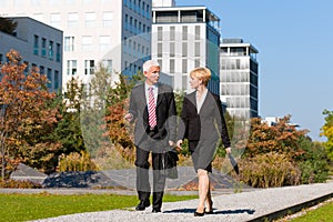 Business people talking outdoors