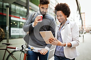 Business people talking outside company with holding coffee break time concept.