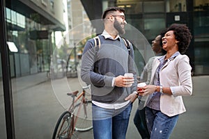 Business people talking outside company with holding coffee break time concept.