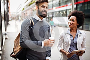 Business people talking outside company with holding coffee break time concept.