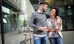 Business people talking outside company with holding coffee break time concept.