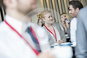 Business people talking to coffee break at lobby in convention center