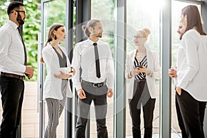 Business people talking together indoors