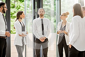 Business people talking together indoors