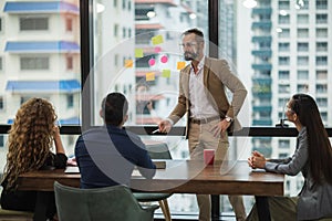 Business people team colleagues in modern office. Man and woman meeting conference and presentation in room