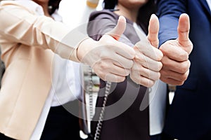 Business people team show thump up together for agreement sign,