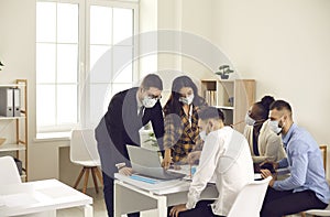 Business people team wearing face mask while working together in office