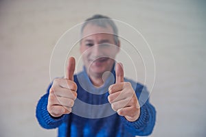 Business, people and teamwork concept - smiling businessman showing thumbs up. Like this!