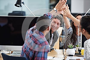 Business people, teamwork and high five for celebration and goals with computer for startup tech company. Happy