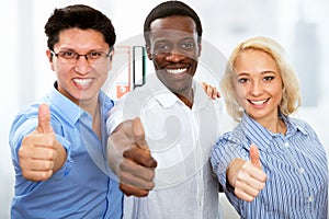 Business people with thumbs up