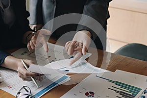 Business people using computer meeting to analyze and discuss the situation on the marketing data online in the meeting room.