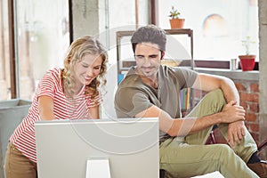 Business people using computer in office