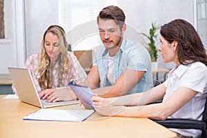 Business people using digital tablet and laptop in meeting