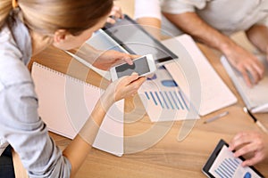 Business people using electronical devices