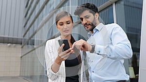 Business People Using Phone Near Office On Street