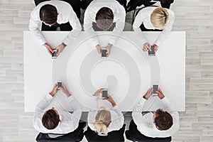 Business people using smartphones