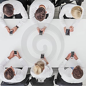 Business people using smartphones