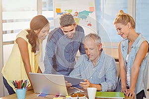 Business people using technologies in meeting room