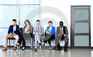 Business people waiting for job interview photo