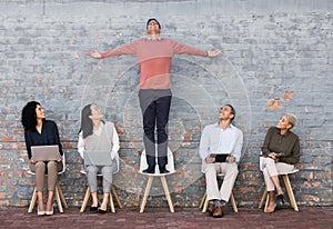 Business people, waiting room and man standing out for interview, meeting or opportunity against a brick wall. Group of