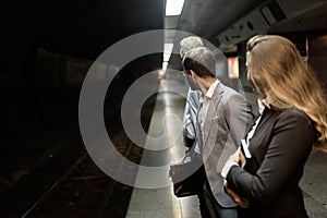 Business people waiting for subway transportation