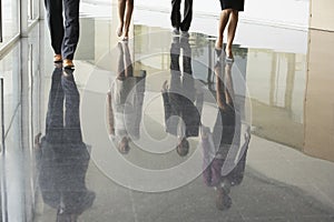 Business People Walking On Marble Flooring