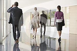 Business People Walking On Marble Flooring