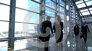 Business people walking in office building