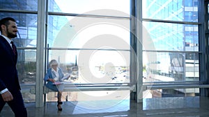 Business people walking in office building