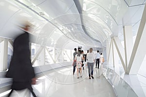 Business people walking in the office corridor.