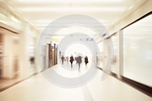 Business people walking in the office corridor