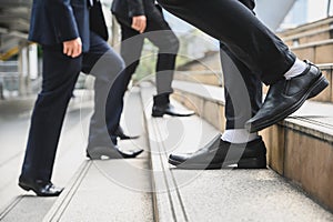 Business people walking on the stairs With a backdrop to the metropolis Finance, application