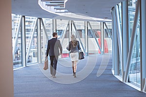 Business people walking together in the corridor at modern office building