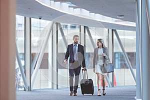 Business people walking together in the corridor at modern office building