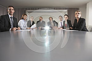 Business People Watching Presentation In Conference Room