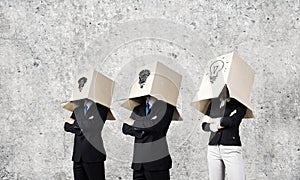 Business people wearing boxes