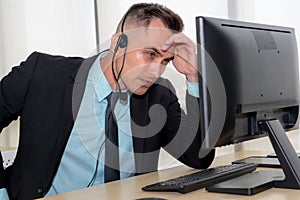 Business people wearing headset feel unhappy working in office