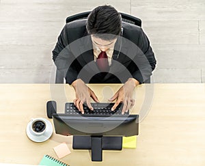 Business people wearing headset from top view in office working with computer