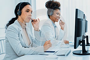 Business people wearing headset working in crucial office