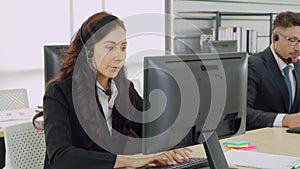 Business people wearing headset working in office