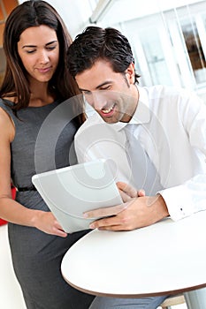 Business people websurfing on tablet photo