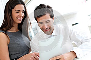 Business people websurfing on tablet photo