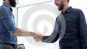 business people welcoming each other by handshake.