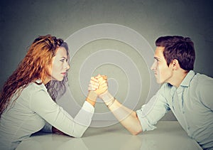 Business people woman and man arm wrestling