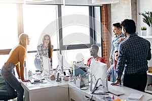 Business people at work in a busy luxury office space