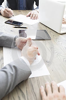 Business people work with documents and computers