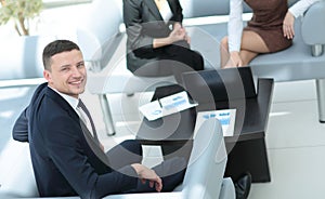 Business people working around table in modern office