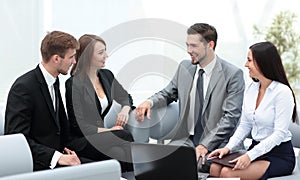 Business people working around table in modern office