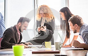 Business people working in board room in office