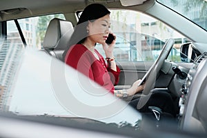 Business People Working In Car And Talking On Cell Phone